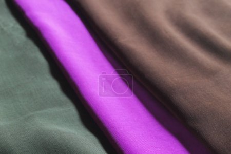 Photo for Texture of the fabric with different color, brown, green, purple, simple clothing photography - Royalty Free Image