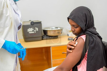 Photo for Abuja, Nigeria - January 22, 2023: Hepatitis Vaccination and Covid-19 vaccination in Africa - Royalty Free Image