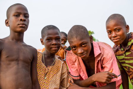 Foto de Abuja, Nigeria - 12 de junio de 2023: Retrato de un niño africano. Random Candid Moments with African Children. Feliz niño africano. Día del Niño en África. - Imagen libre de derechos