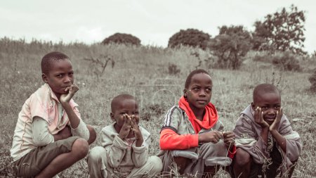 Foto de Abuja, Nigeria - October 5, 2022: Portrait of African Children. Random Candid Moments with African Children - Imagen libre de derechos