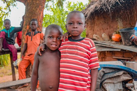 Photo for Opialu, Benue State - February 6, 2022: African Children looking at the camera. - Royalty Free Image