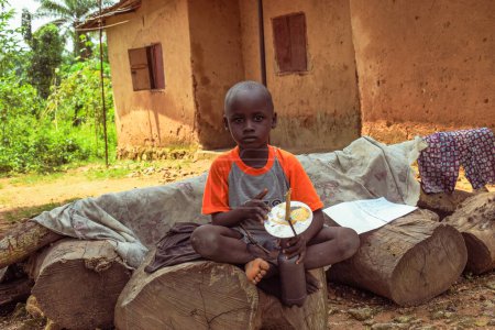 Téléchargez les photos : Opialu, Benue Etat - février 6, 2022 : African Child looking at the camera. - en image libre de droit