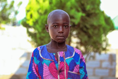 Téléchargez les photos : Opialu, Benue Etat - février 6, 2022 : African Child looking at the camera. - en image libre de droit