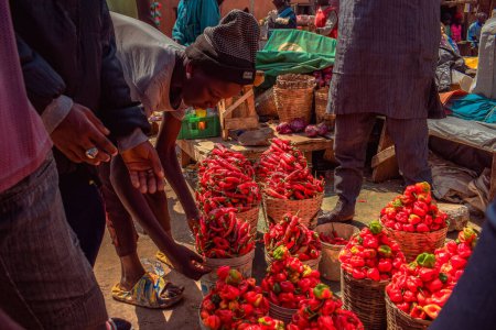 Photo for Abuja, Nigeria - October 8, 2022: Buying and Selling in an African Market Place. Edible and Perishable Food Market in Nigeria - Royalty Free Image