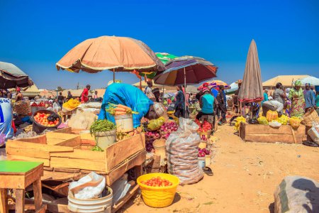 Photo for Abuja, Nigeria - October 8, 2022: Buying and Selling in an African Market Place. Edible and Perishable Food Market in Nigeria - Royalty Free Image