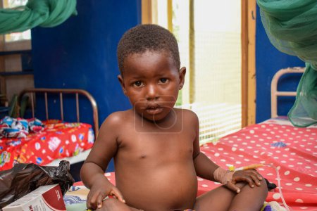 Photo for Ikeja, Lagos State - October 5, 2021: Portrait of an African Child Receiving Medical Care - Royalty Free Image