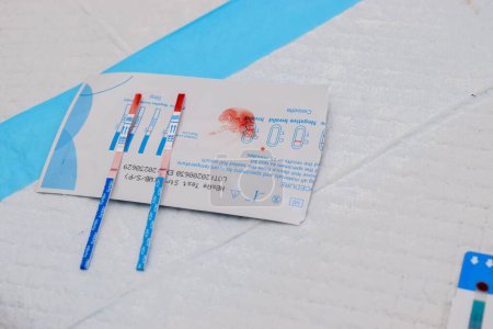 Photo for Ikeja, Lagos State - October 5, 2021: Blood Test. Genotype, Strip Test. Covid-19 or Hemoglobin Test. - Royalty Free Image