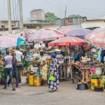 Abuja, Nigeria - October 8, 2022: Buying and Selling in an African Market Place. Edible and Perishable Food Market in Nigeria