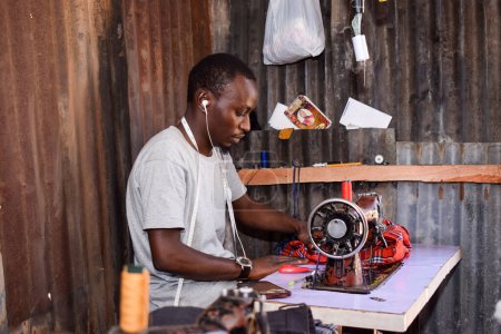 Photo for Jos, Plateau State - April 21, 2021: African Tailor Sewing at workshop - Royalty Free Image