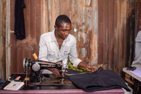 Photo for Jos, Plateau State - April 21, 2021: African Tailor Sewing at workshop - Royalty Free Image