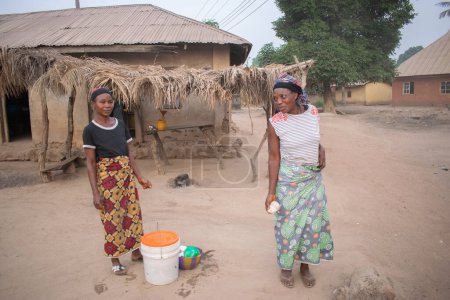 Photo for Opialu, Benue State - March 6, 2021: African women in a Village - Royalty Free Image