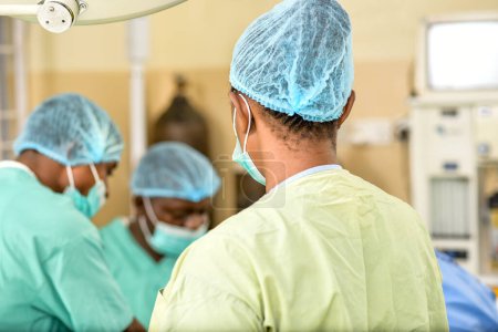 Photo for Jos, Plateau State - May 5, 2021: African Surgeon in a Medical Theatre Getting Ready for an Emergency Session. Doctor on Scrubs - Royalty Free Image