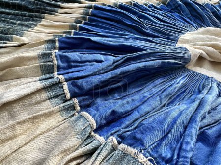 Photo for Blue and white spiral spiral on a white cloth. Hmong tribe skirt in indigo blue hand made, vintage hmong skirt with pleated, pleated skirt, - Royalty Free Image