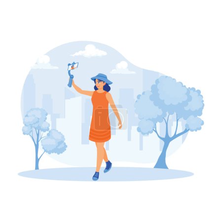 Illustration for A young woman is recording a video on a selfie stick using a cell phone camera. A female vlogger walks on a suburban street. Content Creator concept. Trend Modern vector flat illustration - Royalty Free Image