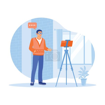 Illustration for A young man stands before a cell phone mounted on a tripod inside the house. The young man presenting something using a mobile phone call conference. Content Creator concept. Trend Modern vector flat illustration - Royalty Free Image