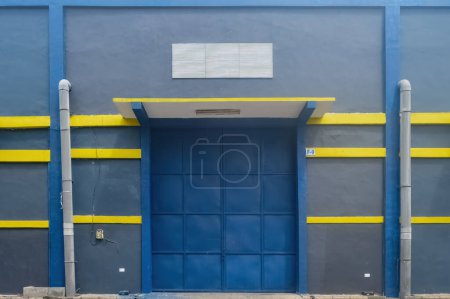 front view of an industrial warehouse with iron doors