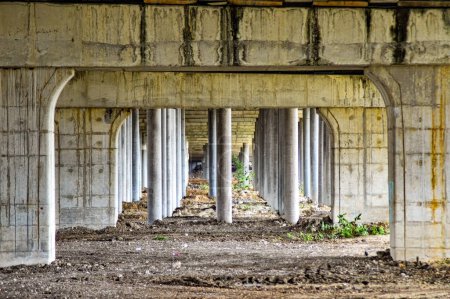 Photo for Under toll road bridges or highways where there are many bridge pillars. perspective view. - Royalty Free Image
