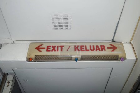 exit sign on the aircraft door corridor