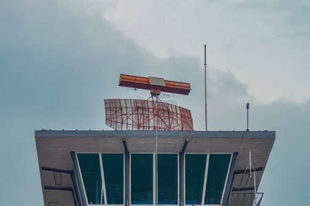 Photo for A Primary Surveillance Radar (PSR) on top of the Air Traffic Control tower at Juanda International Airport, Surabaya, Indonesia, 6 January 2024 - Royalty Free Image