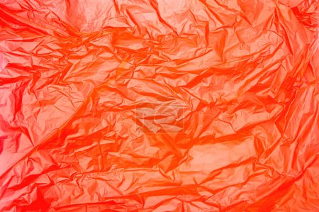 texture of orange plastic bag crumpled. Copy space