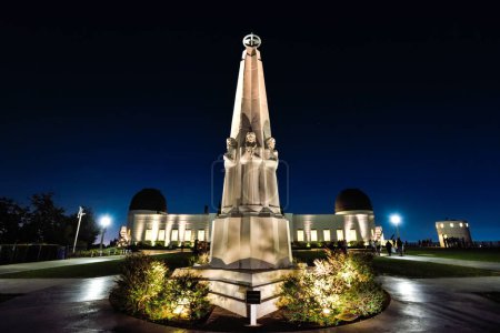 The Astronomers Monument in front of Griffith Observatory at Night - Los Angeles, California