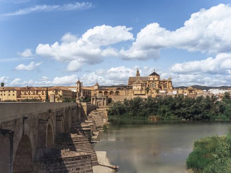 The view of the Mezquita Cathedral Mosque of Cordoba with the Roman Bridge (Puente Romano) during summer, Cordoba, Andalusia, Spain