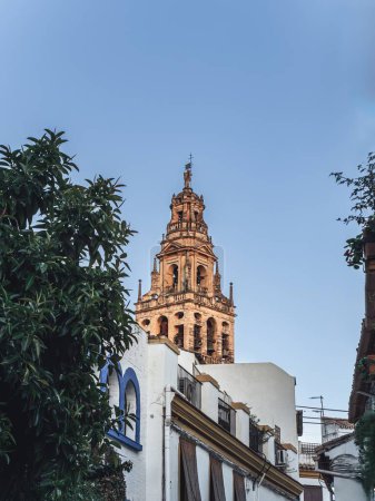 Iconic Tower and Bell Tower of the Mezquita-Catedral, mosque cathedral in Cordoba during summer, white buildings, Andalusia, Spain