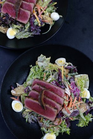 Photo for The nicoise salad with fresh tuna and crunchy vegetables in a bowl - Royalty Free Image