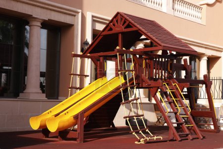 Photo for Modern wooden children playground in park with multy activities - Royalty Free Image