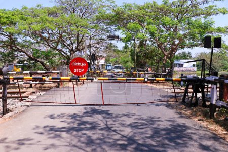 Photo for Indian railway level crossing gates with stop board - Royalty Free Image