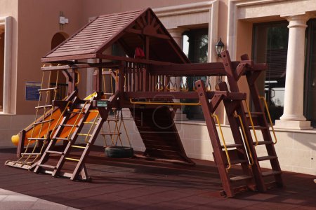 Photo for Modern wooden children playground in park with multy activities - Royalty Free Image