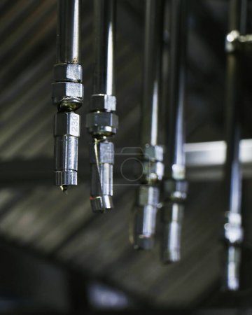 Photo for Fire and safety equipment, emergency water dispenser sprinkler under the roof hood usually fixed in kitchen, factories and warehouses to prevent the fire accident in the premise - Royalty Free Image