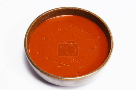 Photo for Traditional roasted tomato soup in a bowl with white background - Royalty Free Image