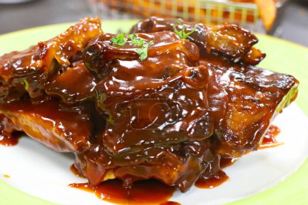 Photo for Pork baby ribs glazed with barbeque sauce - Royalty Free Image