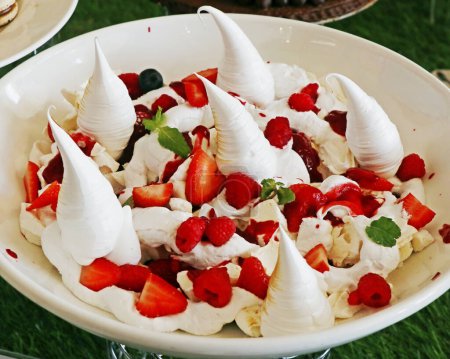 Photo for Eton mess , traditional English dessert consisting of a mixture of berries, meringue, and whipped cream. - Royalty Free Image