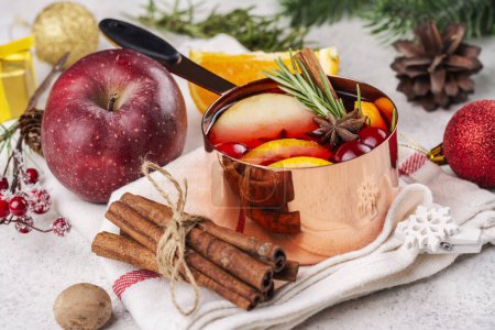 Photo for Hot mulled wine with fruits and spices. Autumn or winter warm drink - Royalty Free Image