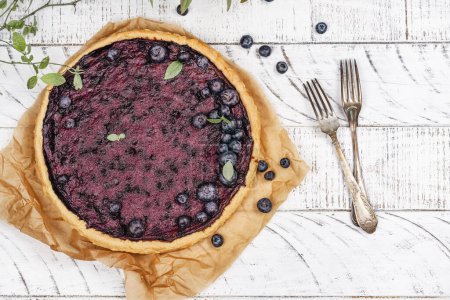 Photo for Traditional finnish blueberry pie. National blueberry day - july 8. Top view. Copy space - Royalty Free Image