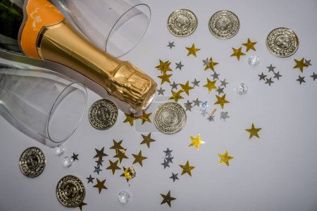 Photo for New year background with Champagne and Coins and stars. Christmas Celebration. High quality photo - Royalty Free Image