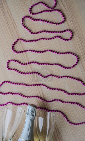Photo for New year background with Champagne and purple beads. Christmas Celebration. High quality photo - Royalty Free Image