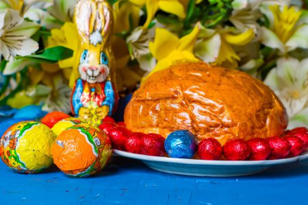 Home baked traditional Easter bread or Paska decorated for festive table, with eegs, front view. High quality photo