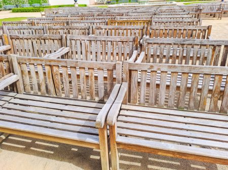 Old wooden benches that stand in the Wallenstein gardens in Prague, are waiting for performances. Czech.. High quality photo