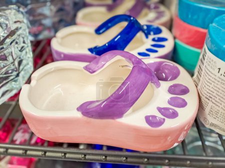 Photo for Ceramic ashtray in the shape of a flip flop. Vacation Concept. High quality photo - Royalty Free Image