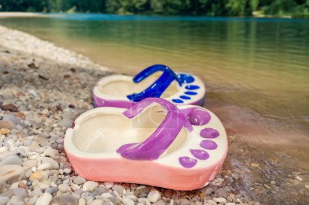 Photo for Ceramic ashtray in the shape of a flip flop by the riner. Tourism. Vacation Concept. High quality photo - Royalty Free Image