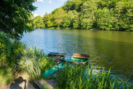 Beautiful views of the river Berounka a Wooden boats in the spring season. Czech, Near Karlstejn. High quality photo