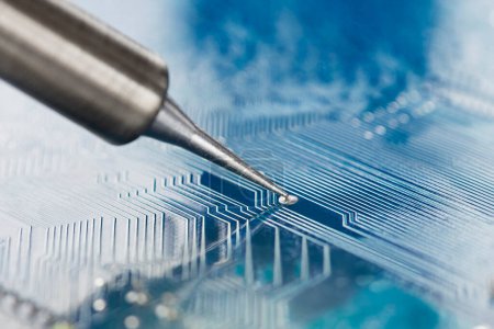 Photo for Soldering electronic components onto the PCB. Electronics repair and digital technology. - Royalty Free Image