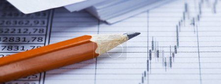 Accounting document with pencil, financial diagram and checking financial chart. Concept of banking, financial report and financial audit.