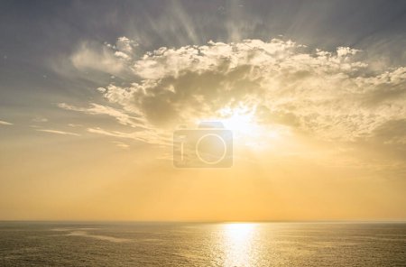 Photo for Sunrise view from the sea near Santorini island, Greece. - Royalty Free Image