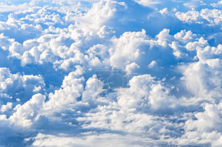 Photo for Blue sky and silky white clouds with impressive shapes, seen in the heights - Royalty Free Image