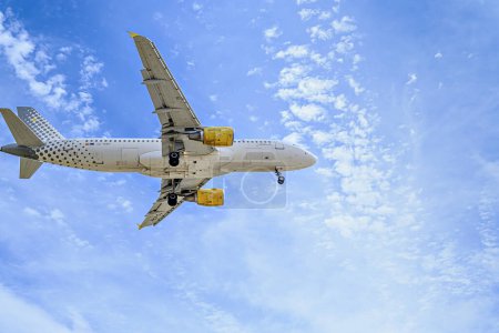 Photo for Barcelona, Spain; April 10, 2023: Vueling Airbus A320 plane, landing at Josep Tarradellas Barcelona-El Prat airport - Royalty Free Image