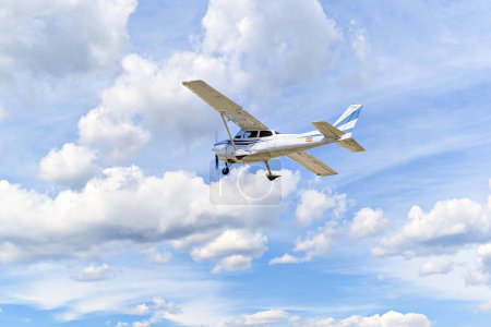 Photo for Single engine ultralight plane flying in the blue sky with white clouds - Royalty Free Image